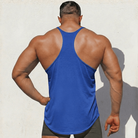 Person wearing a blue tank top against a light background